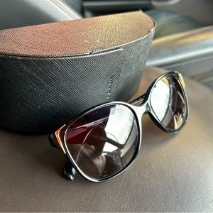 Little to no use Prada sunglasses - no damage comes with case.